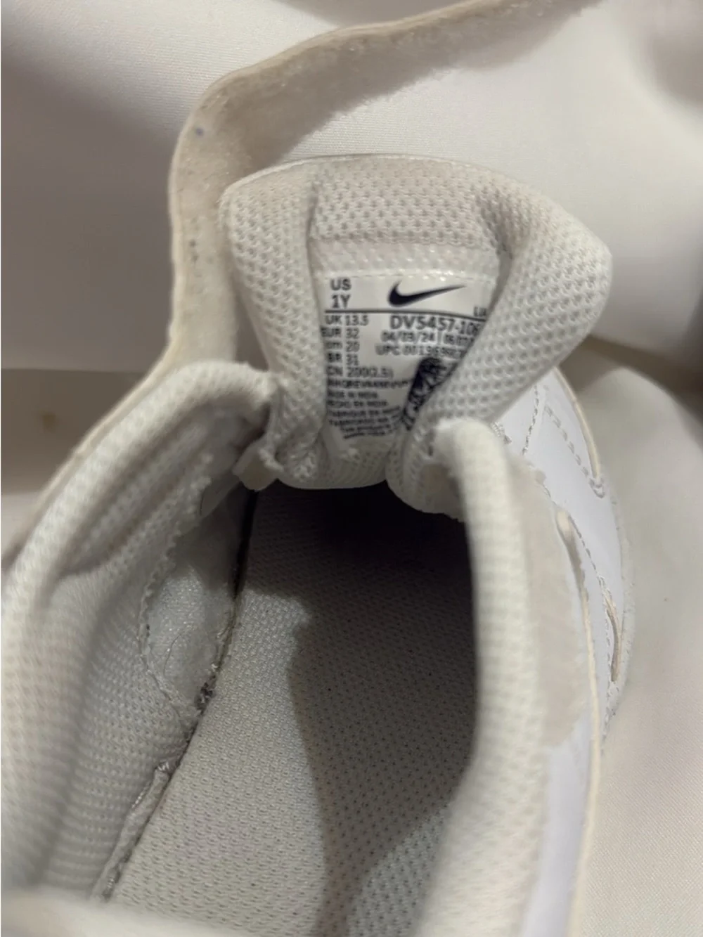 Boys white Nike sneakers